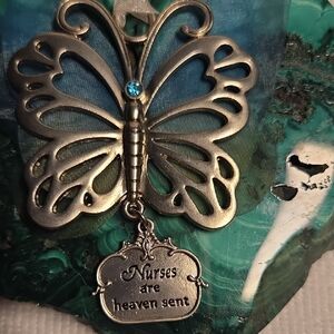 Sterling Silver Butterfly Nurse Pendant with Blue Gem